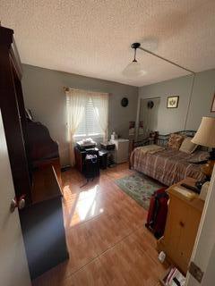 bedroom with a textured ceiling