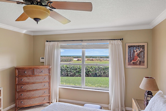 bedroom with crown molding, a textured ceiling, and ceiling fan