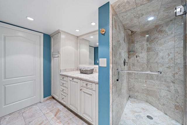 bathroom with vanity and a shower with shower door