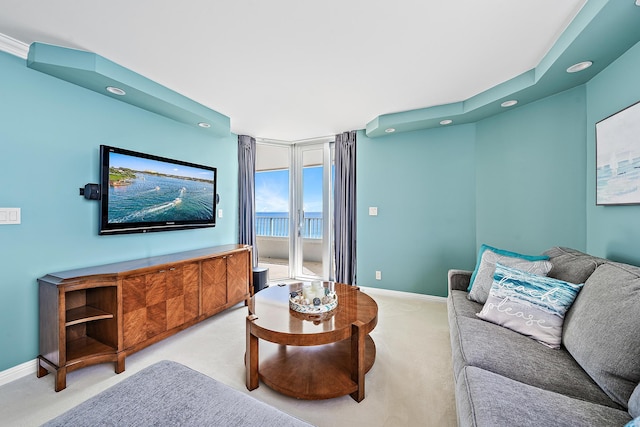 carpeted living room featuring recessed lighting and baseboards