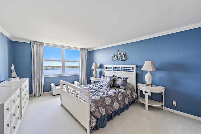 bedroom featuring crown molding, light colored carpet, and a water view