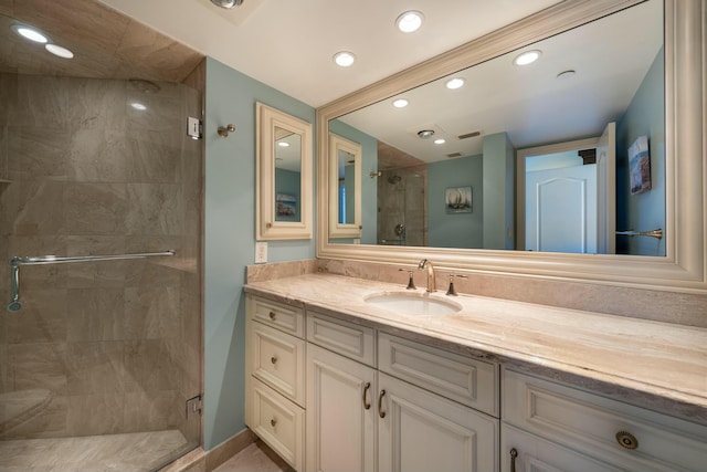 bathroom with visible vents, a stall shower, vanity, and recessed lighting