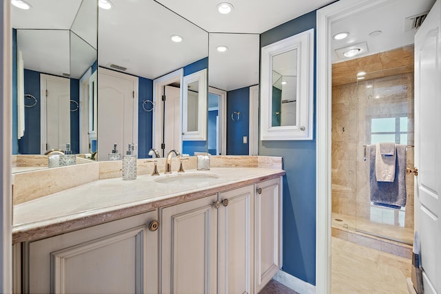 bathroom with recessed lighting, visible vents, a shower stall, vanity, and baseboards