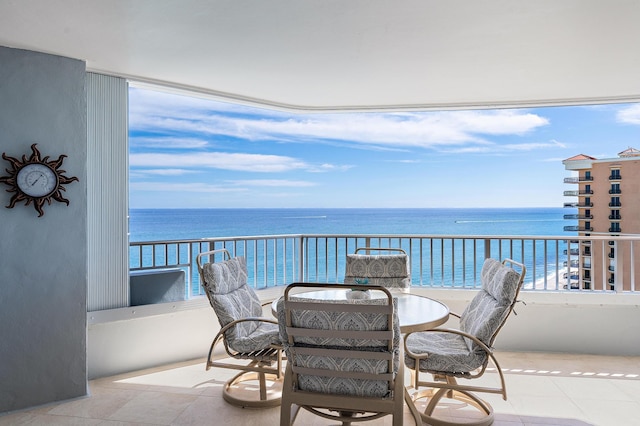 balcony featuring a water view