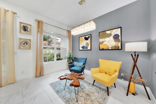 living area with marble finish floor and baseboards