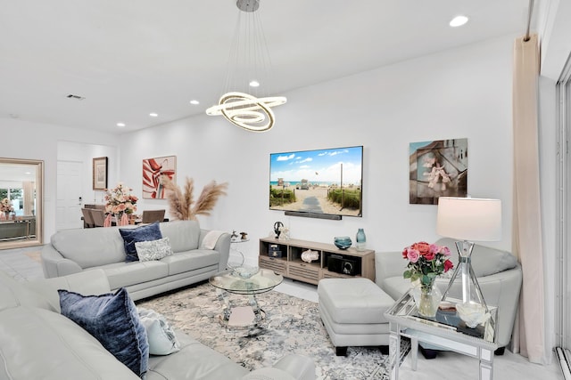 living area featuring a notable chandelier, visible vents, and recessed lighting