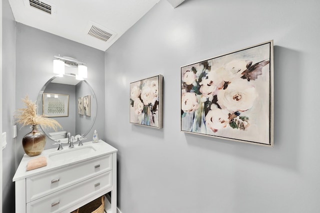 bathroom with visible vents and vanity