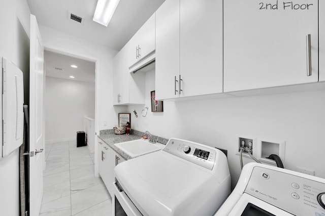 laundry area with a sink, visible vents, marble finish floor, cabinet space, and washer and clothes dryer