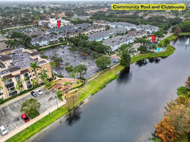 aerial view featuring a residential view and a water view