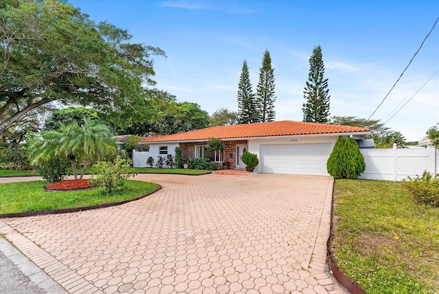 ranch-style house with a front lawn and a garage