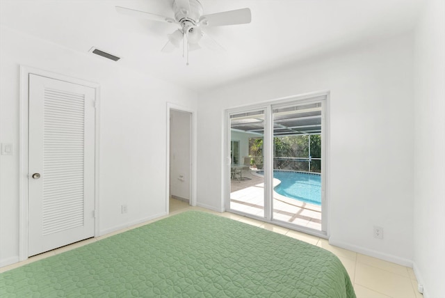 unfurnished bedroom with light tile patterned floors, ceiling fan, access to exterior, and a closet