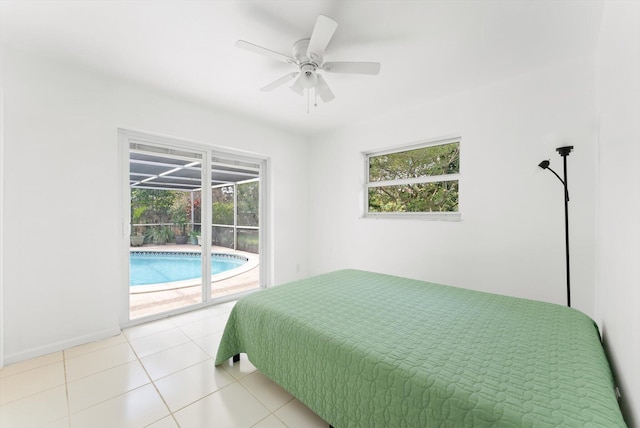 bedroom with ceiling fan, light tile patterned floors, and access to outside