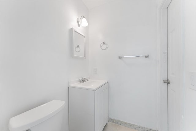 bathroom with tile patterned floors, toilet, and vanity