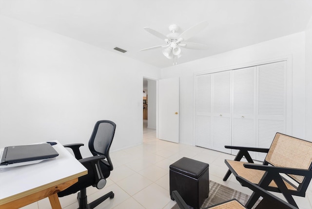 office space featuring ceiling fan and light tile patterned flooring