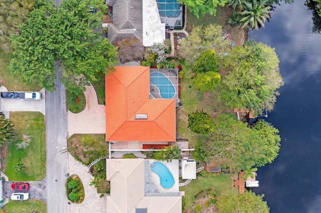 birds eye view of property with a water view