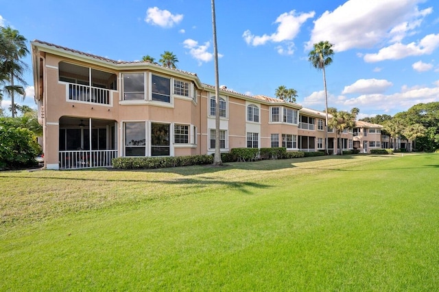 view of home's community featuring a lawn