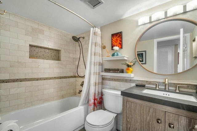 full bathroom with toilet, shower / tub combo, vanity, and tile walls