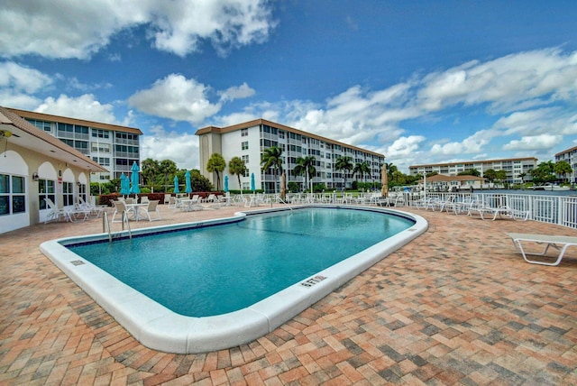 view of swimming pool featuring a patio area