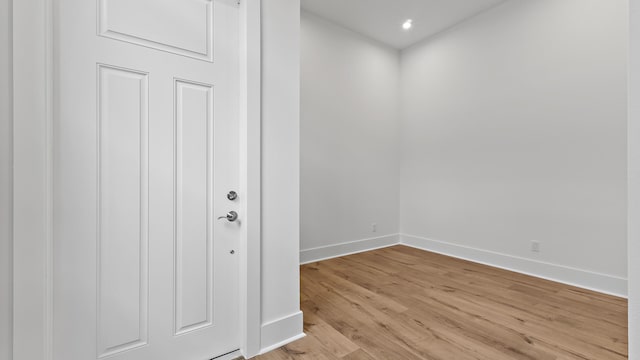 205 SE Via Sangro, Port Saint Lucie, FL 34952 - foyer with baseboards, light wood-type flooring, and recessed lighting