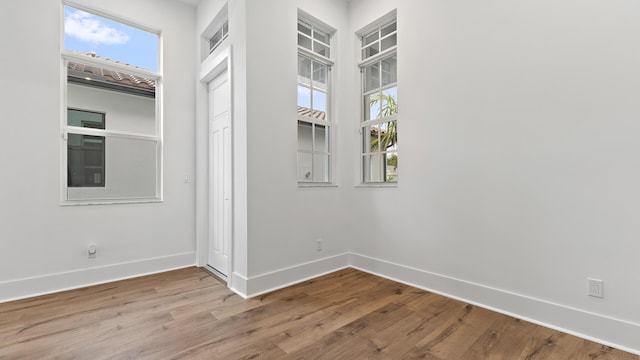 205 SE Via Sangro, Port Saint Lucie, FL 34952 - empty room with baseboards and wood finished floors