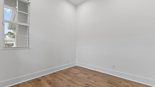 205 SE Via Sangro, Port Saint Lucie, FL 34952 - unfurnished room featuring baseboards and wood finished floors