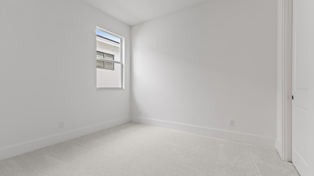 205 SE Via Sangro, Port Saint Lucie, FL 34952 - empty room featuring carpet floors and baseboards