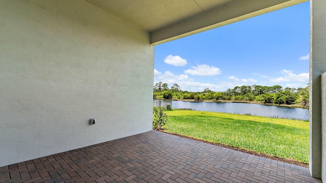 205 SE Via Sangro, Port Saint Lucie, FL 34952 - view of patio / terrace with a water view