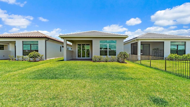 205 SE Via Sangro, Port Saint Lucie, FL 34952 - rear view of property featuring stucco siding and a tiled roof