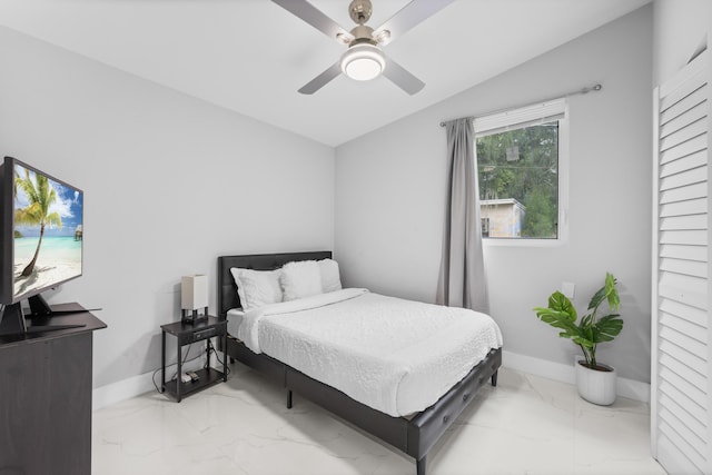 bedroom featuring ceiling fan and vaulted ceiling