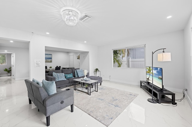 living room with an inviting chandelier