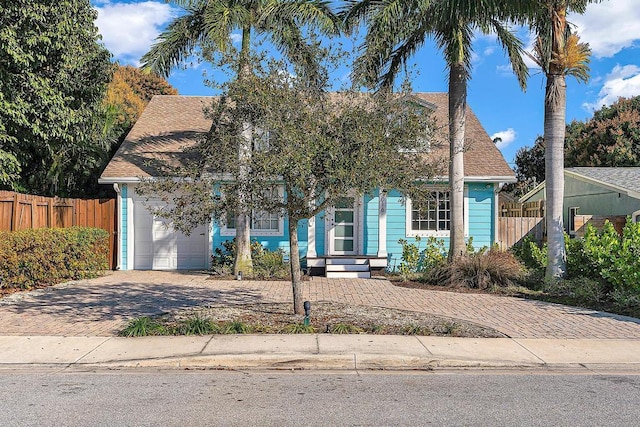 obstructed view of property featuring a garage