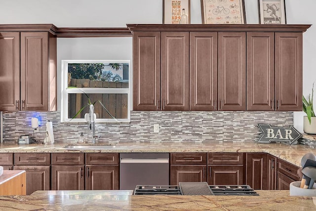 kitchen featuring sink, backsplash, stainless steel dishwasher, light stone counters, and dark brown cabinets