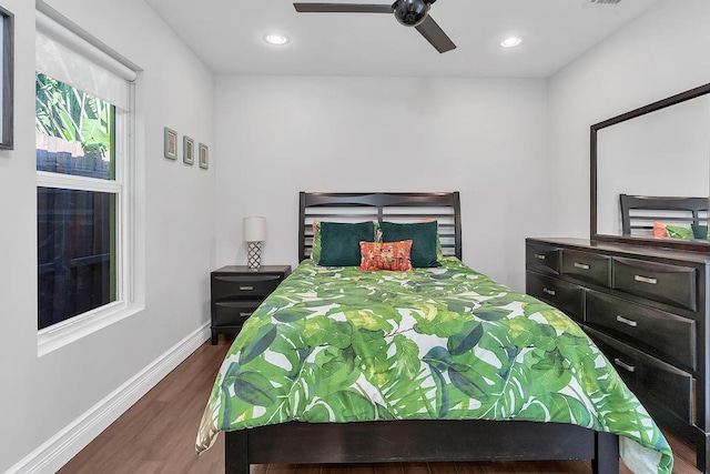 bedroom with dark wood-type flooring and ceiling fan