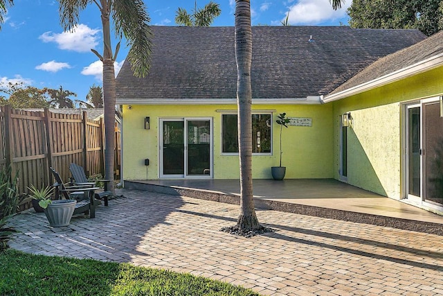 rear view of house with a patio