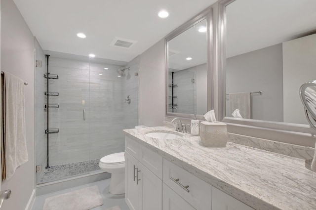 bathroom with toilet, an enclosed shower, and vanity