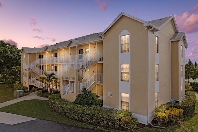 view of outdoor building at dusk