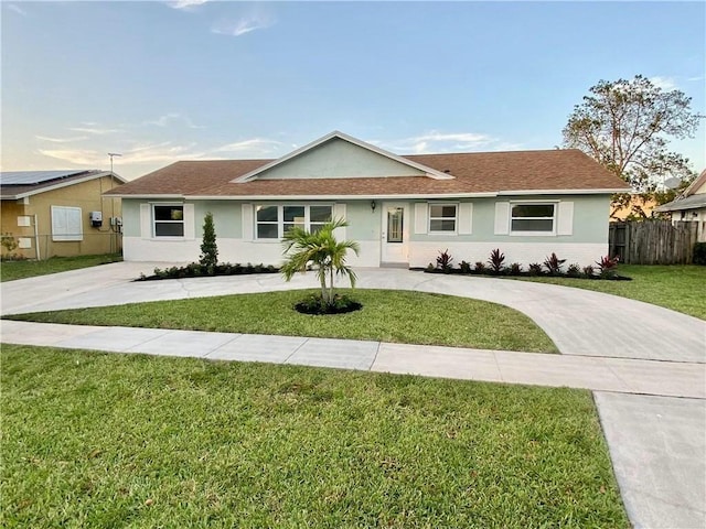 ranch-style house with a front yard