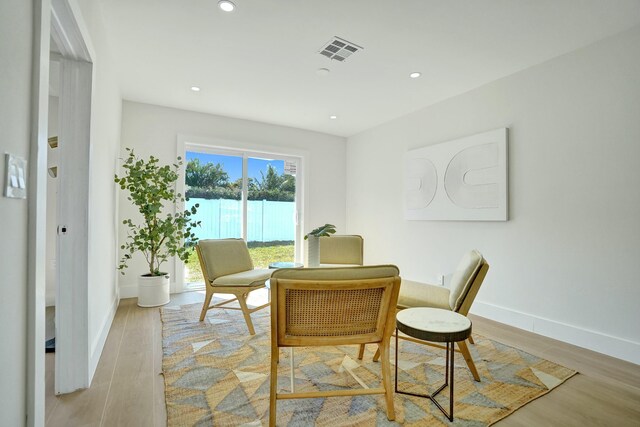 office with ceiling fan and light hardwood / wood-style floors