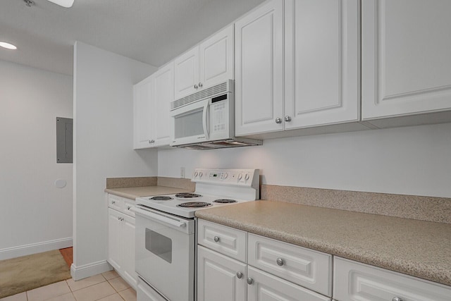 kitchen with electric panel, light tile patterned floors, white cabinetry, and white appliances