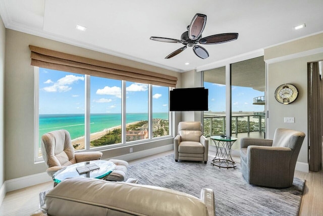 sunroom / solarium featuring ceiling fan