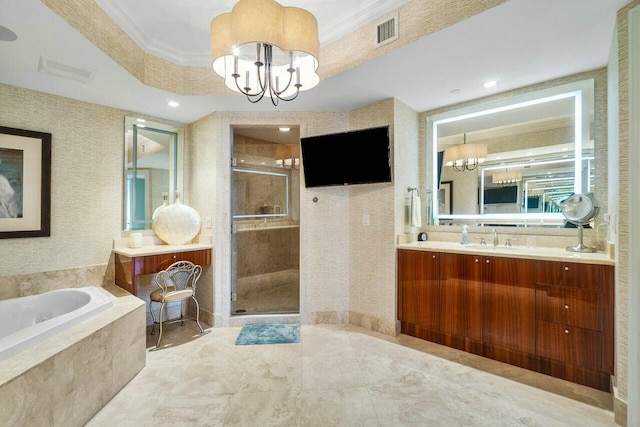 bathroom featuring vanity, a raised ceiling, an inviting chandelier, ornamental molding, and shower with separate bathtub