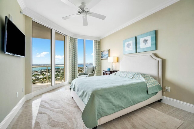 bedroom with ceiling fan, expansive windows, access to outside, and ornamental molding