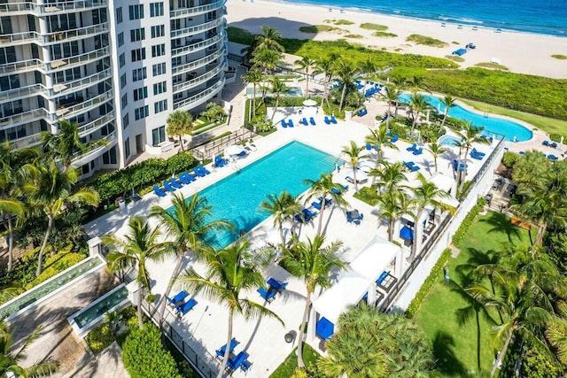 drone / aerial view with a water view and a view of the beach