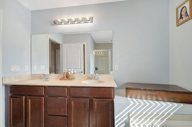 bathroom with an enclosed shower and vanity