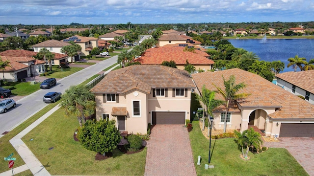 birds eye view of property with a water view