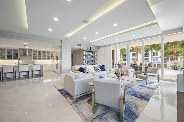 living room featuring a wall of windows