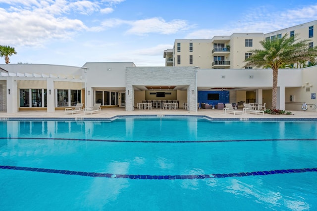 view of swimming pool featuring a pergola and a patio