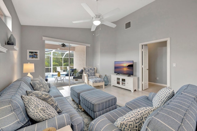 living room featuring high vaulted ceiling and ceiling fan