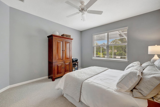 bedroom with ceiling fan and carpet floors