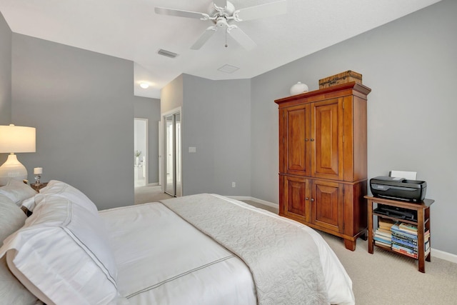 bedroom featuring light carpet and ceiling fan